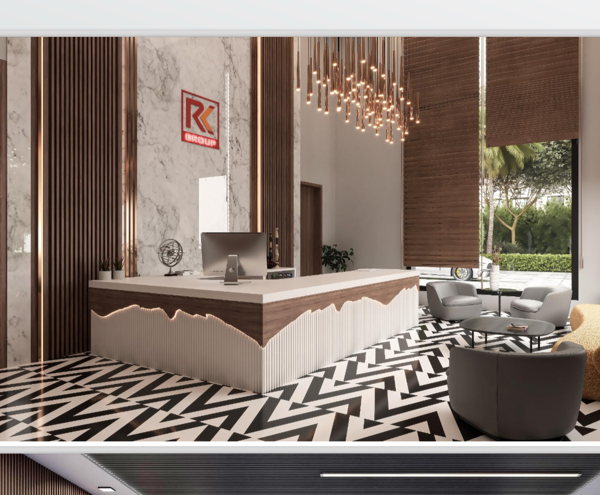 Reception in marble and copper with the RK Group logo and chevron floor