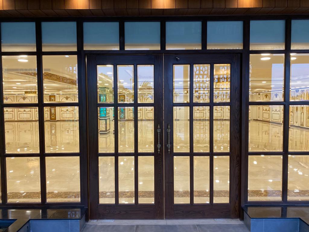 Wood-framed glazed entrance doors