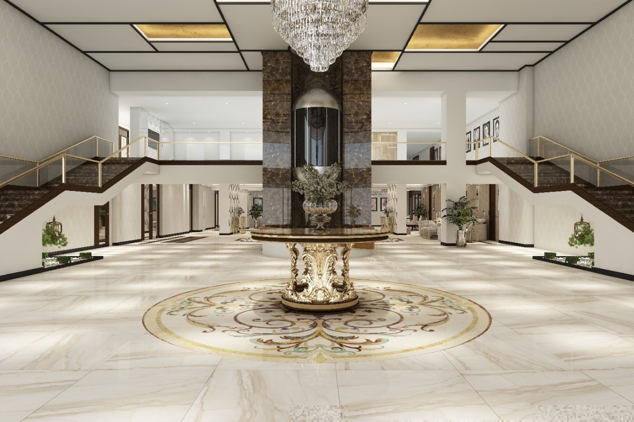 Grand double-stair lobby with a marble column and gold pedestal table