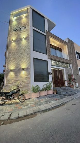 Exterior facade of the Rameez residence at dusk
