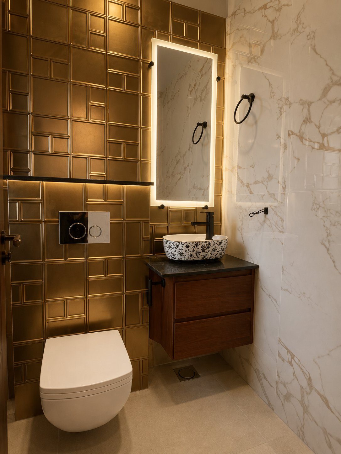 Brass-tiled powder room with marble accent wall